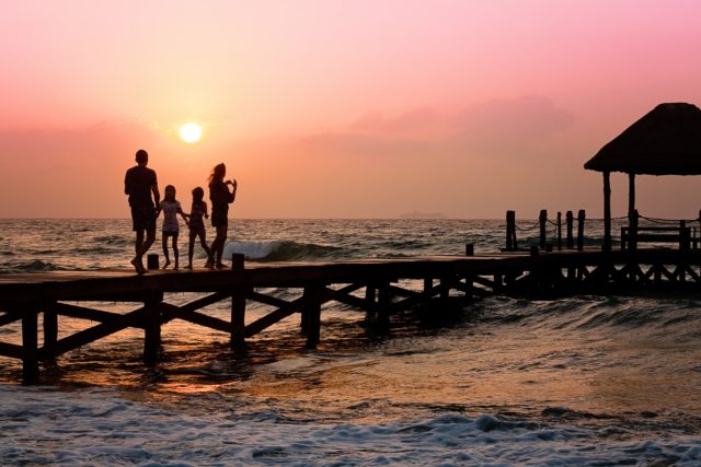 How to break up your family and ruin your life, family on a pier at sunset