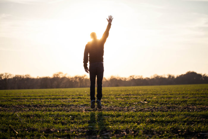 one spirit- man walks into a sunset in a field, hand raised in the air, Gospel, Funeral, Grief, Grieving, Children