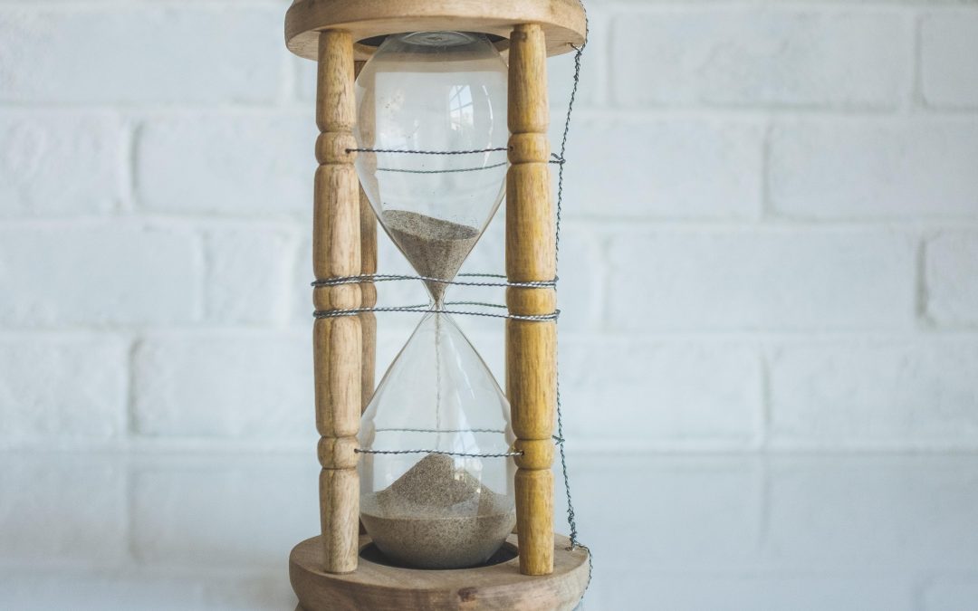 hourglass-against-white-brick-wall-what-are-the-best-things-clock-is-tyrant-kingdom-of-god-being-busy